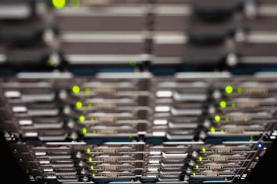 web performance optimization - Close-up of a network server rack with blinking LEDs, showcasing Ethernet connections and patch panels.