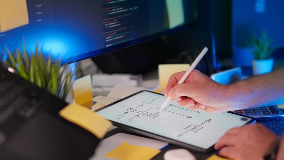 MCP - Someone is drawing on a tablet at their desk.