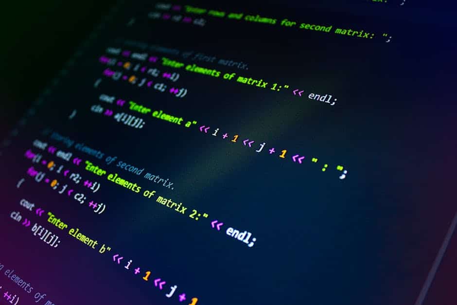 PostgreSQL tuning techniques - Close-up of colorful programming code displayed on a monitor screen.
