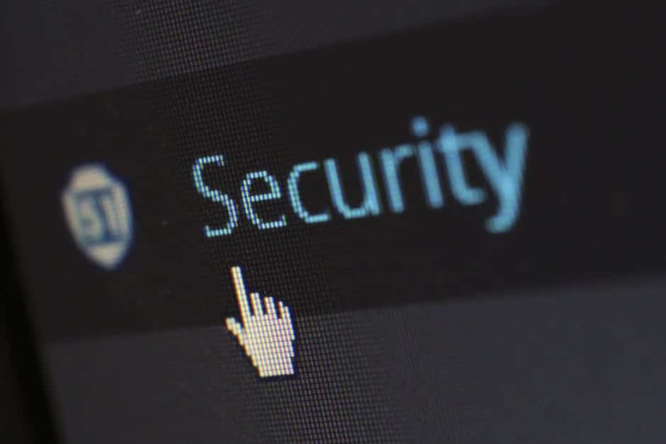 OWASP Top 10 risks - Close-up view of a mouse cursor over digital security text on display.