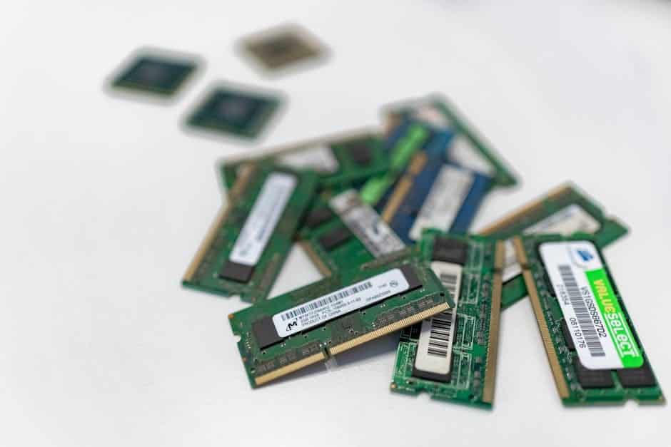 Redis patterns - Assorted RAM modules scattered on a white surface, showcasing technology components.