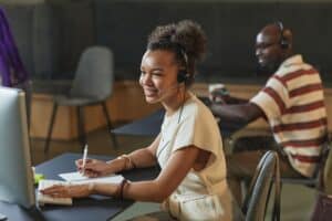 Receptionist answering a business phone call with a headset